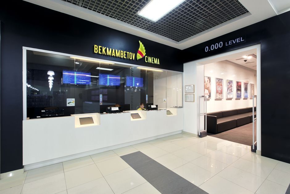 cinema ticket counter movie poster display United States