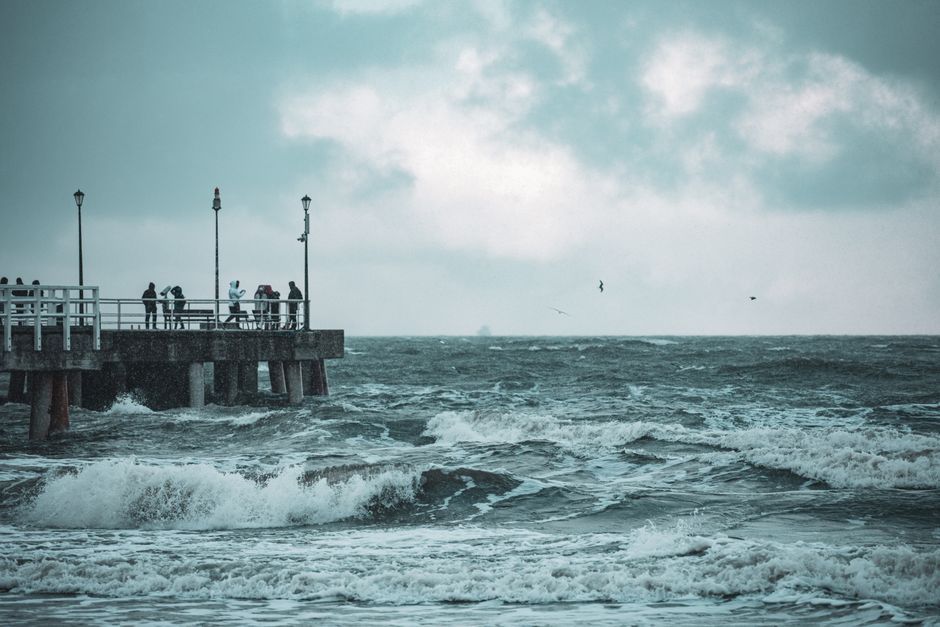 UK coastal storm rough sea waves pier Northern Ireland