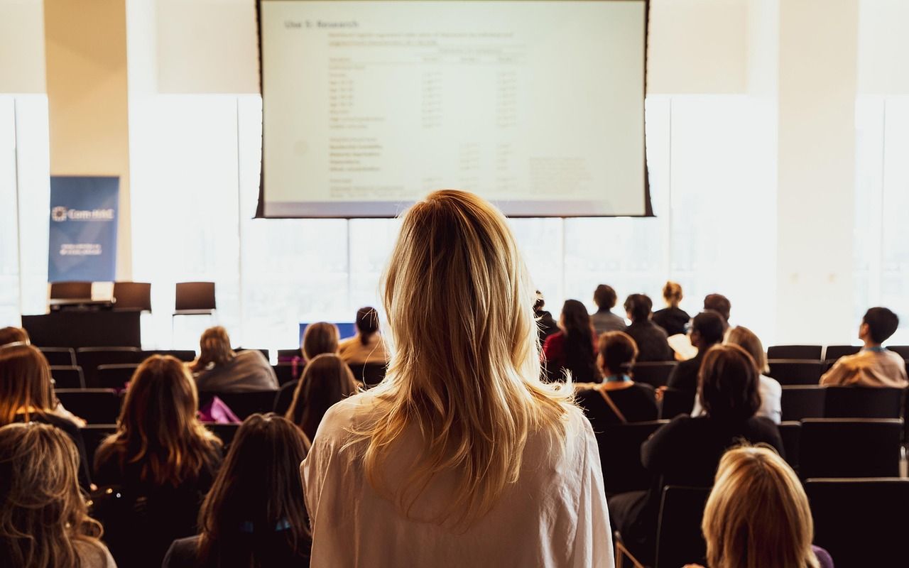 business conference speaker presentation screen daytime