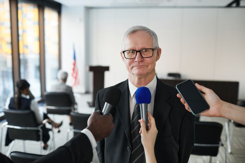 British political commentator microphone interview