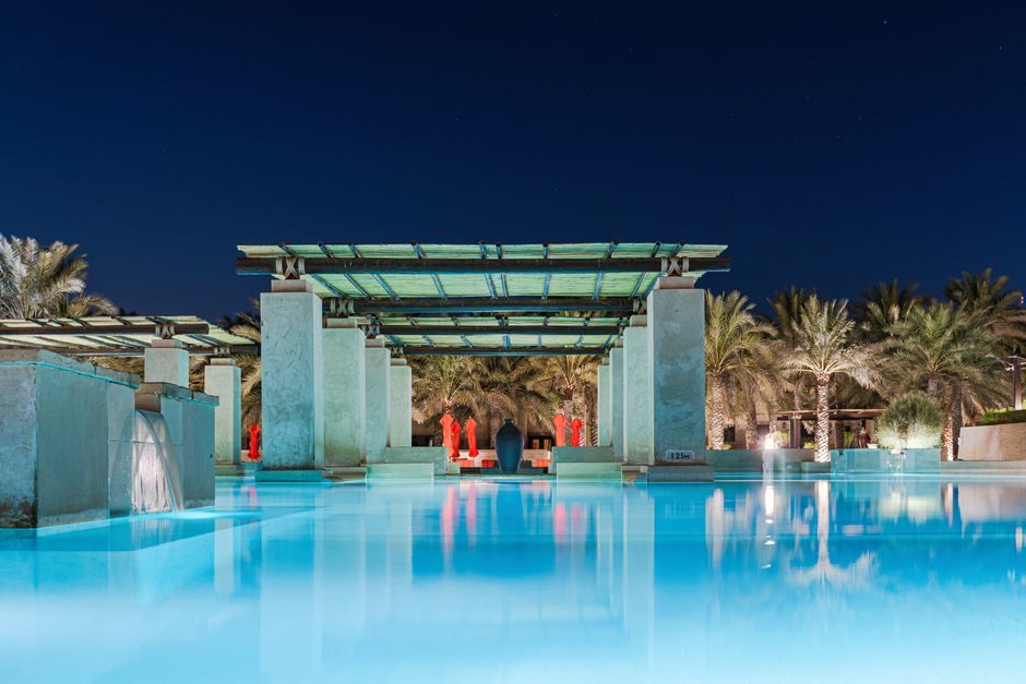 Dubai hotel resort swimming pool evening view United Arab Emirates