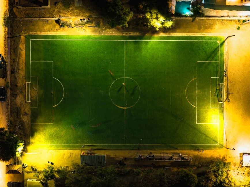 soccer match stadium floodlights night