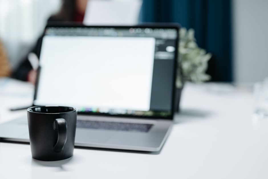 modern office laptop computer professional workspace UK