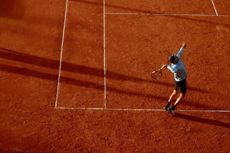 tennis player celebrating match victory on court