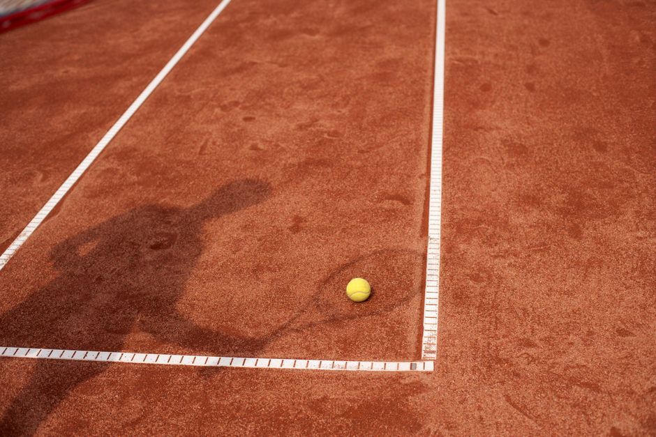 professional tennis player celebrating match point tennis racket