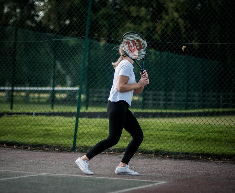tennis racket tennis ball court grass