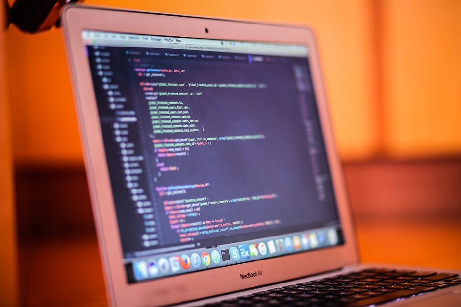 computer science students coding laptop workspace