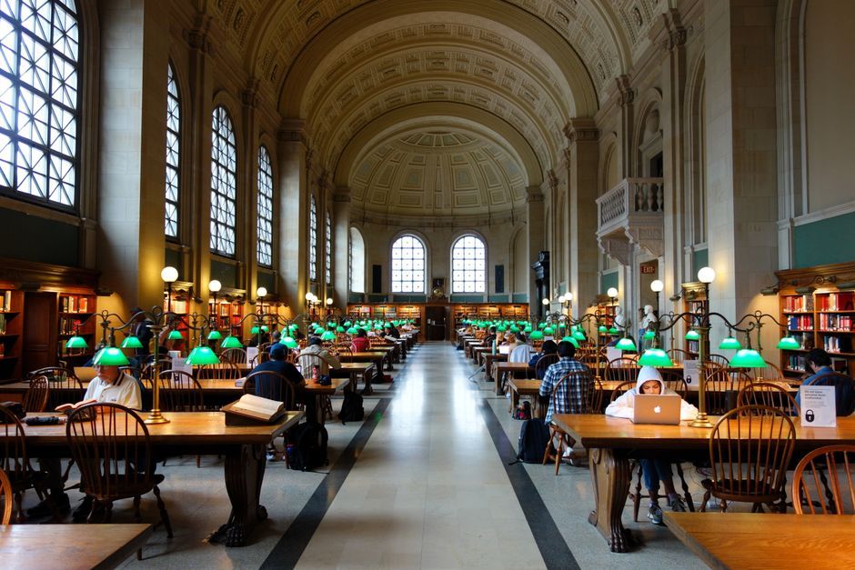 library wooden reading tables green lamps interior Paris