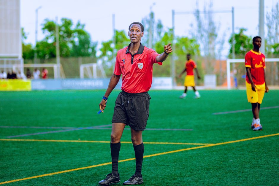soccer referee VAR monitor screen pitch