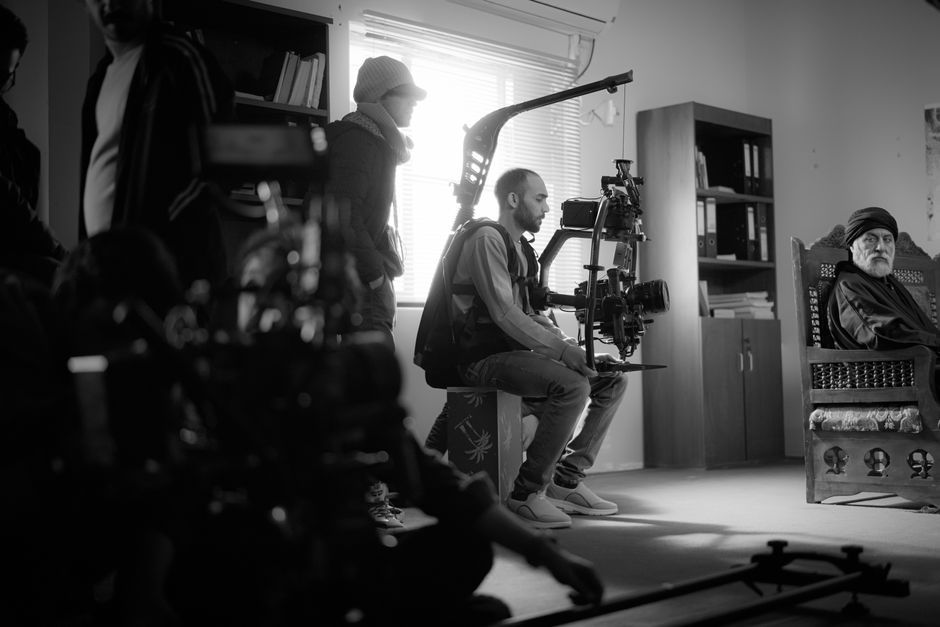 film director working in production office studio