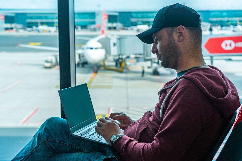 airplane passenger using laptop device