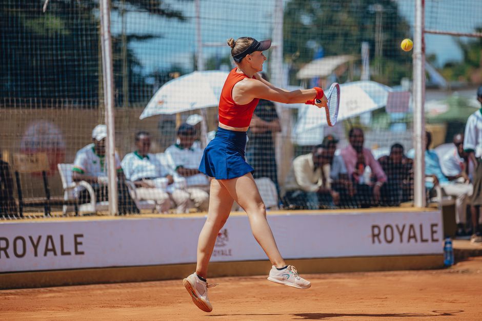 professional female tennis player on court match action