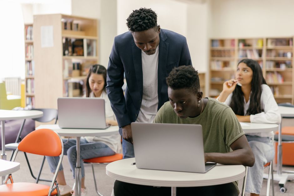 Cameroon university students studying together laptop