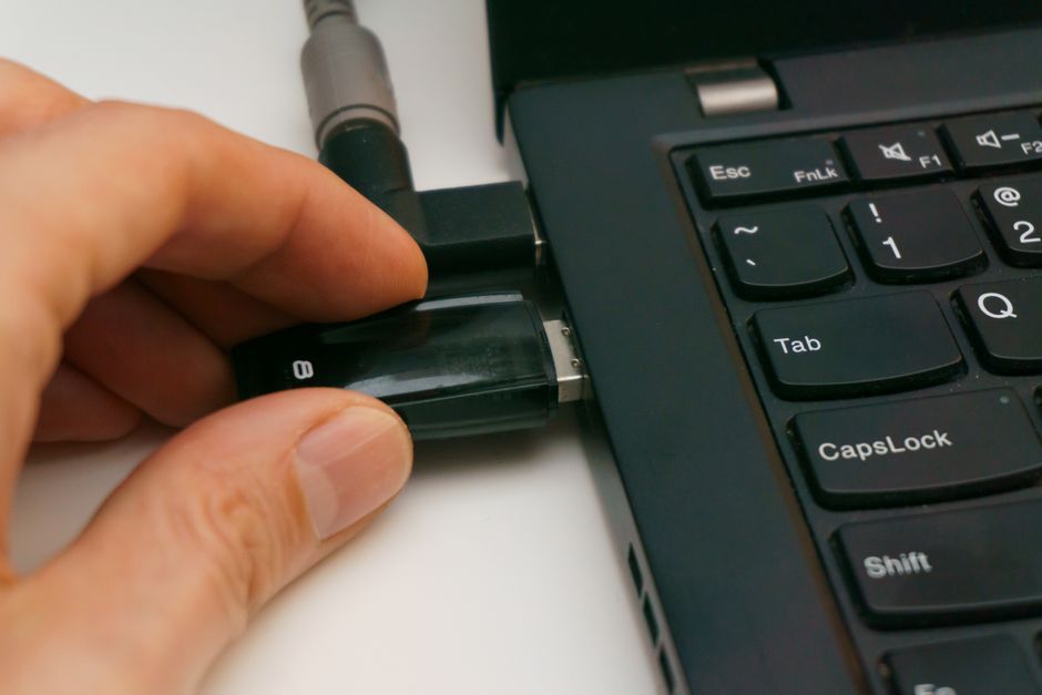 USB security key plugged into laptop