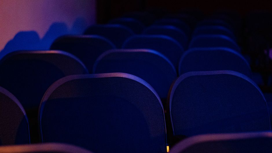 cinema movie theater auditorium seats dim lighting