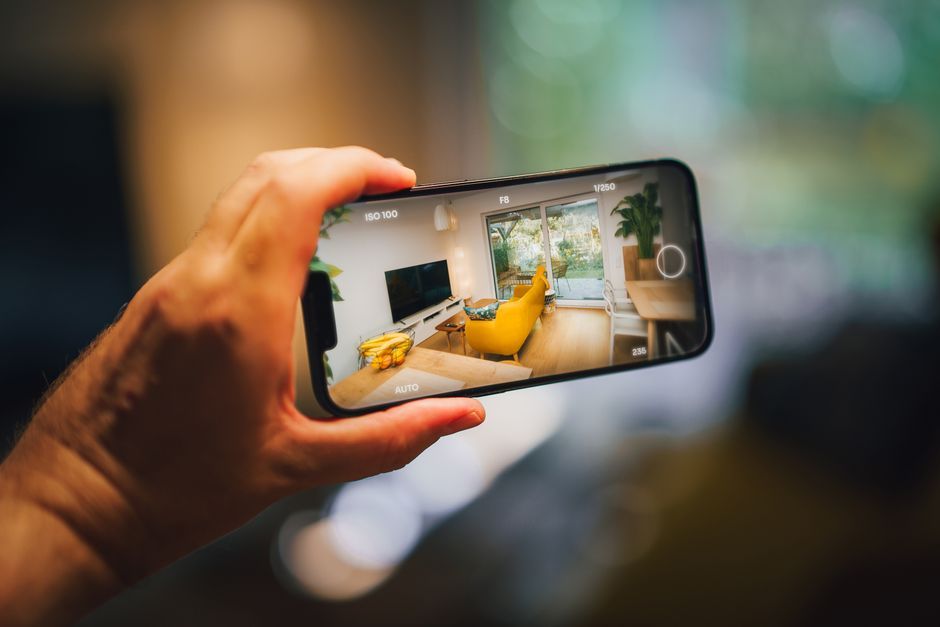 smartphone with real estate app screen